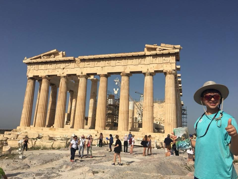 Me at Greece with Sea of Monsters Book